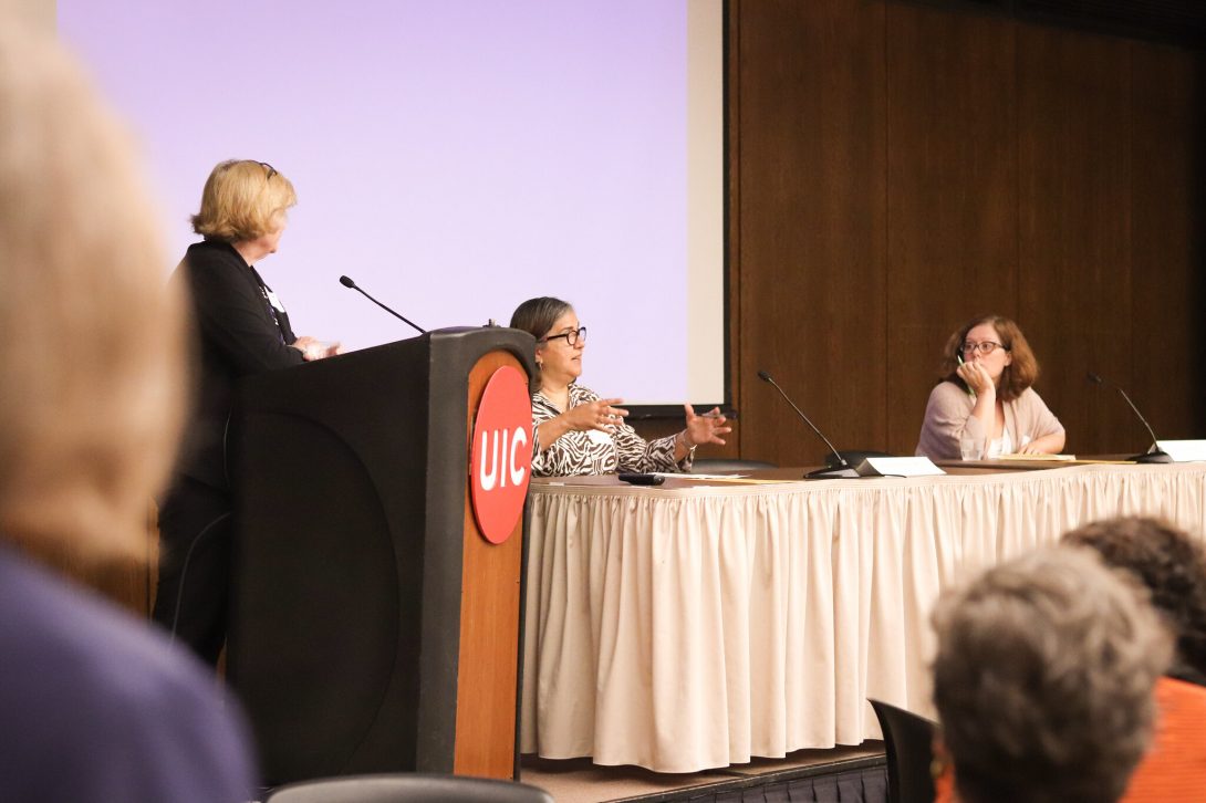 Moderator Maryfrances Miley on stage with panelists Aixa Alfonso and Sara Hall