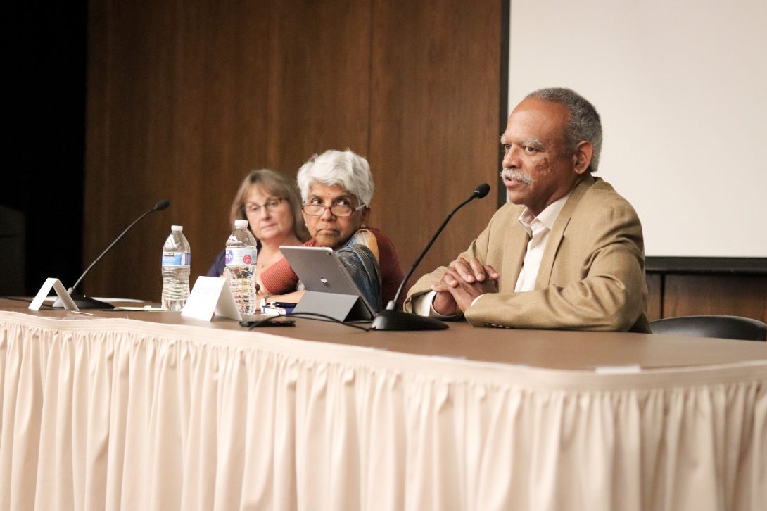 Meena Rao and William Walden sitting on stage