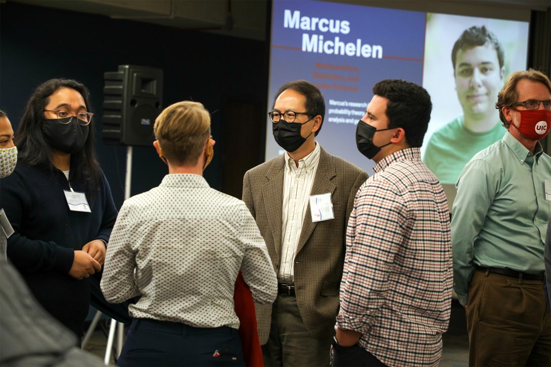 Scholars talking in a circle