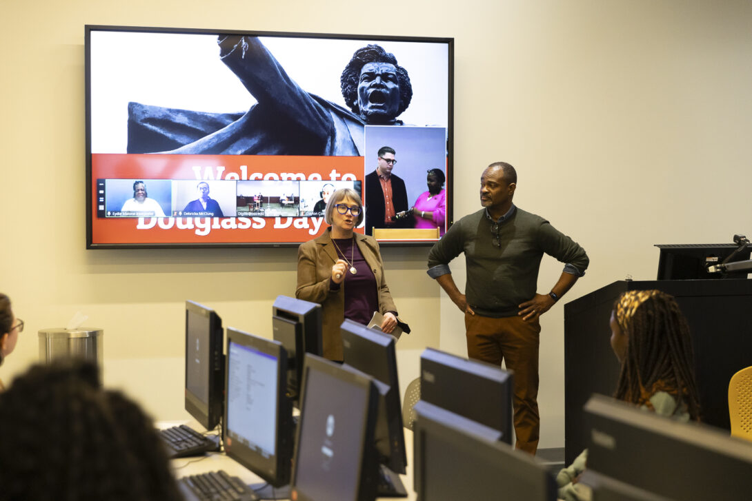 Amy Bailey and Joseph Jewell discuss the Douglass Day transcription event with participants.
