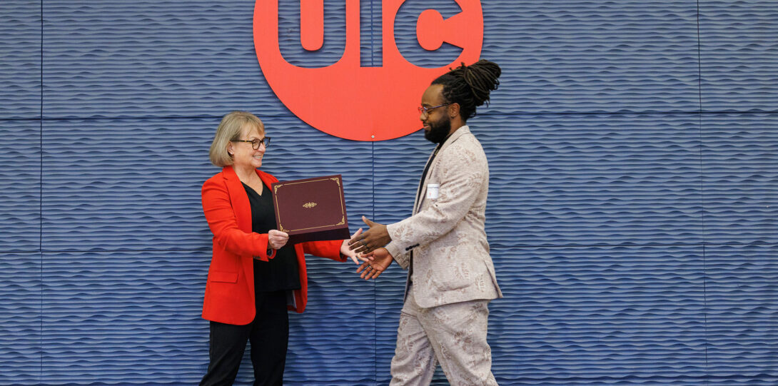 The provost congratulating a new faculty member.